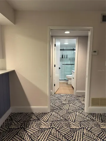 a bathroom with a sink and a shower