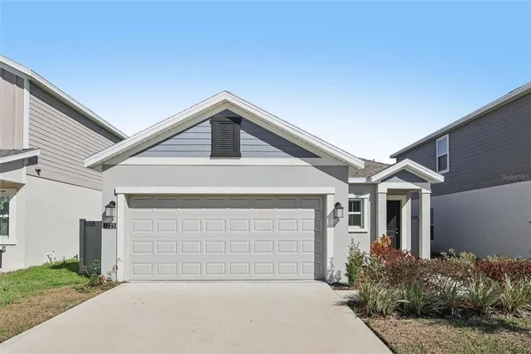 a front view of a house with garage