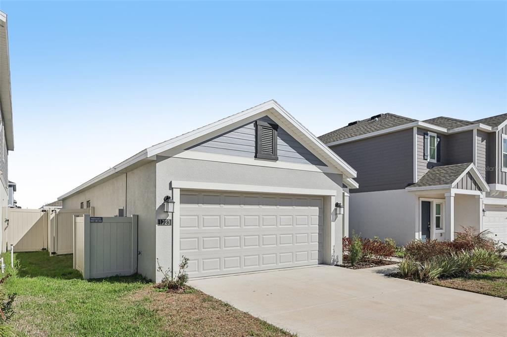 1723 Foreman Road Eagle Lake, FL 33839 - Photo 2 of 34 a view of a house with a garage