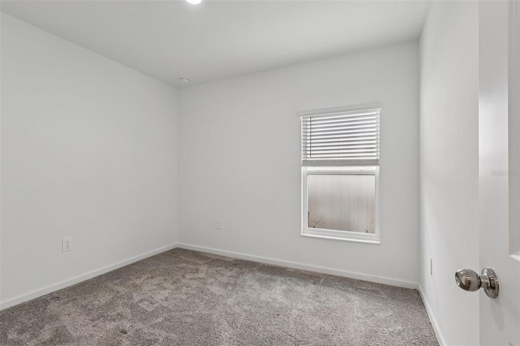 1723 Foreman Road Eagle Lake, FL 33839 - Photo 21 of 34 an empty room with a window