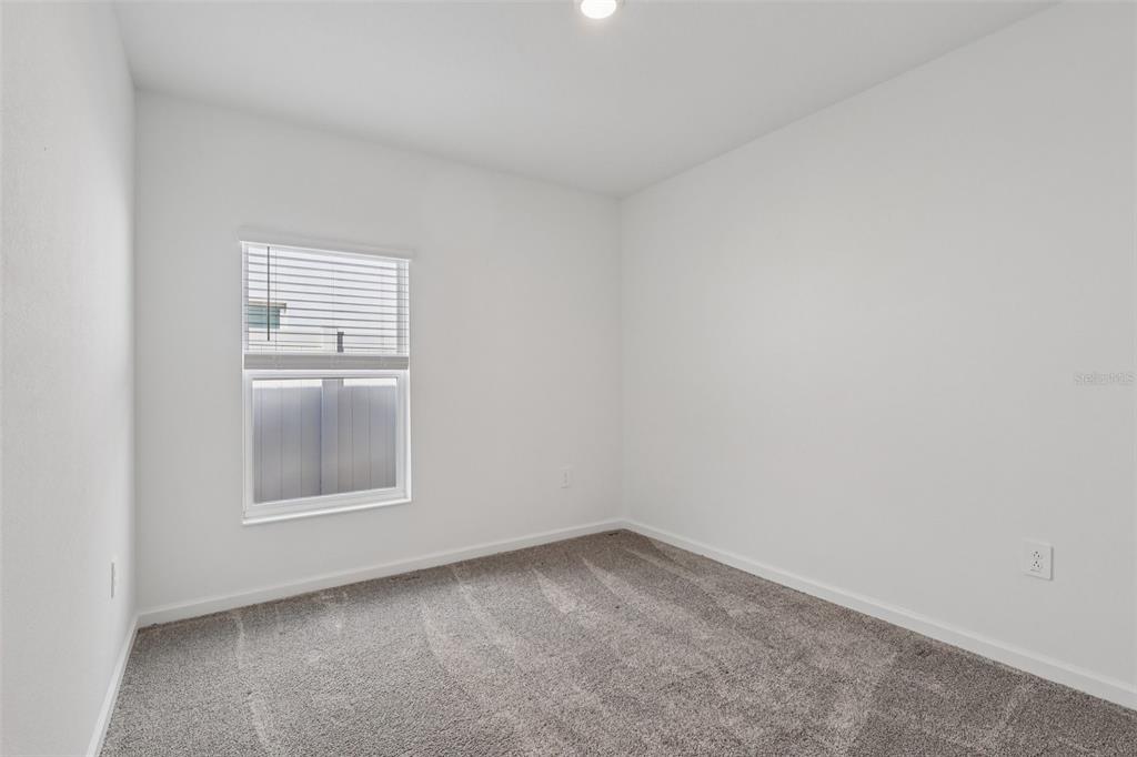 1723 Foreman Road Eagle Lake, FL 33839 - Photo 23 of 34 an empty room with a window