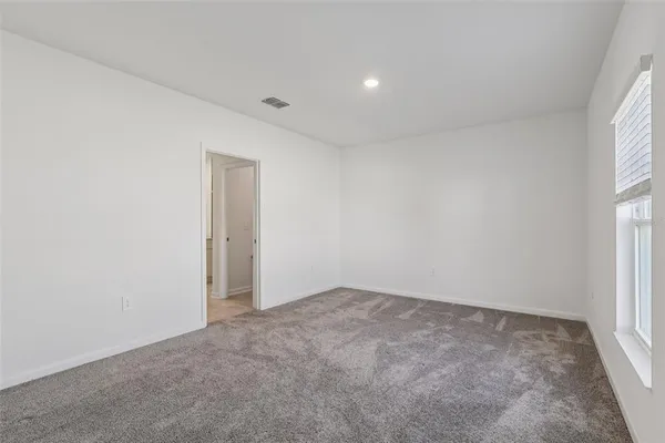 a bathroom with a shower sink and mirror