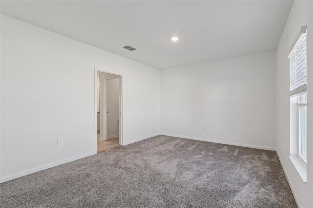 1723 Foreman Road Eagle Lake, FL 33839 - Photo 25 of 34 an empty room with a window