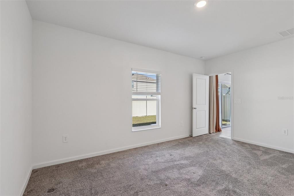 1723 Foreman Road Eagle Lake, FL 33839 - Photo 26 of 34 an empty room with windows and closet
