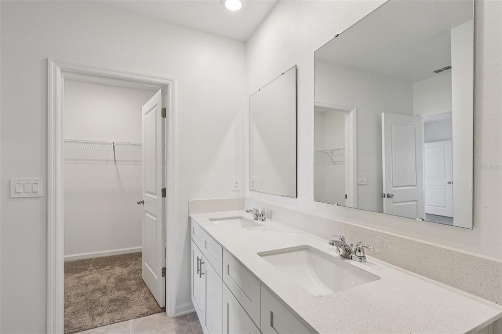 1723 Foreman Road Eagle Lake, FL 33839 - Photo 28 of 34 a bathroom with a sink and a mirror
