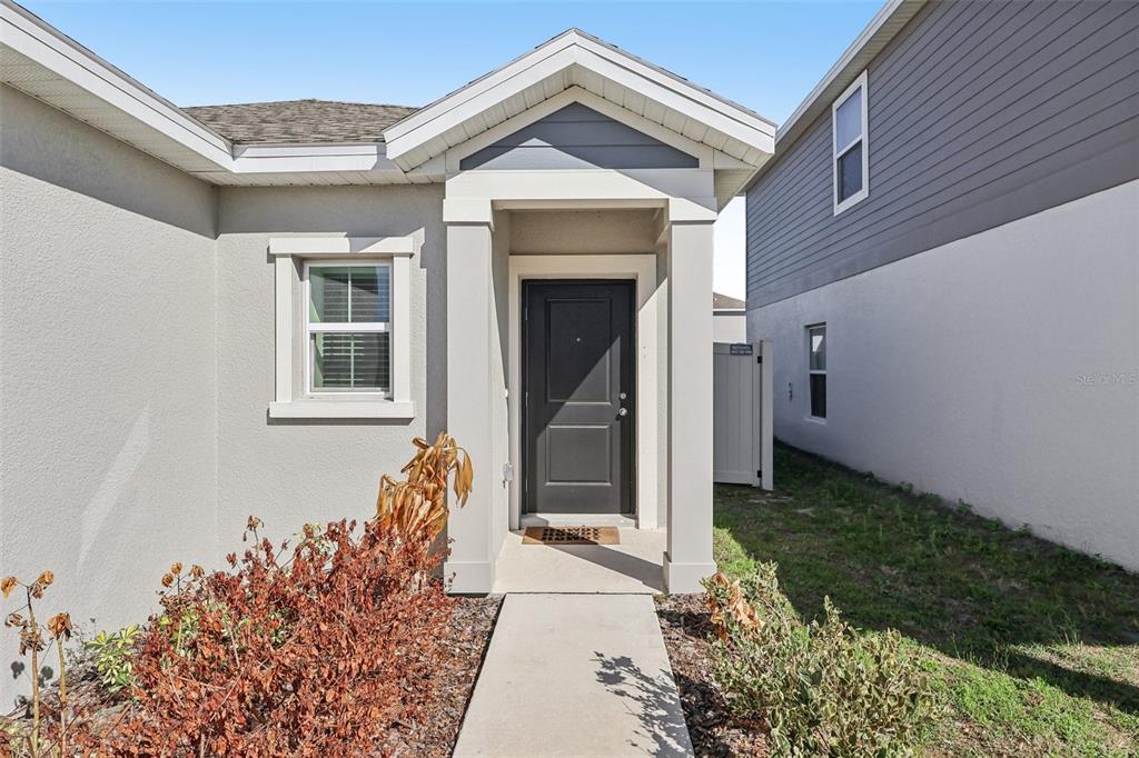 1723 Foreman Road Eagle Lake, FL 33839 - Photo 4 of 34 a front view of a house with garden
