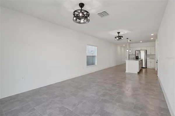 a view of an empty room and a window