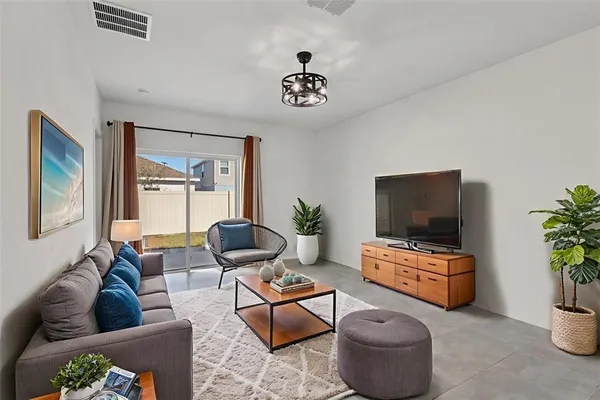 a view of a kitchen with a sink and a refrigerator