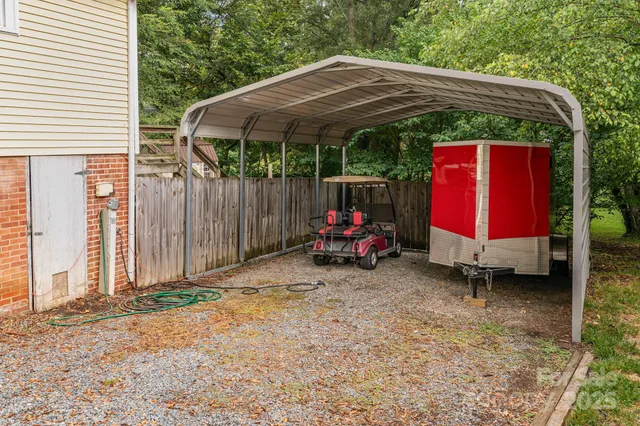 a view of a backyard with a small cabin and a chair