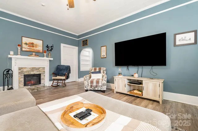 a living room with furniture and a flat screen tv