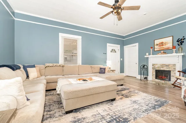 a bedroom with a bed and ceiling fan