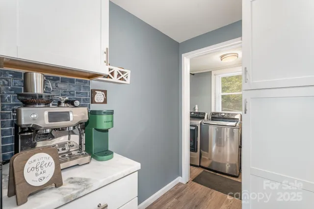 a kitchen with stainless steel appliances granite countertop a refrigerator and a stove