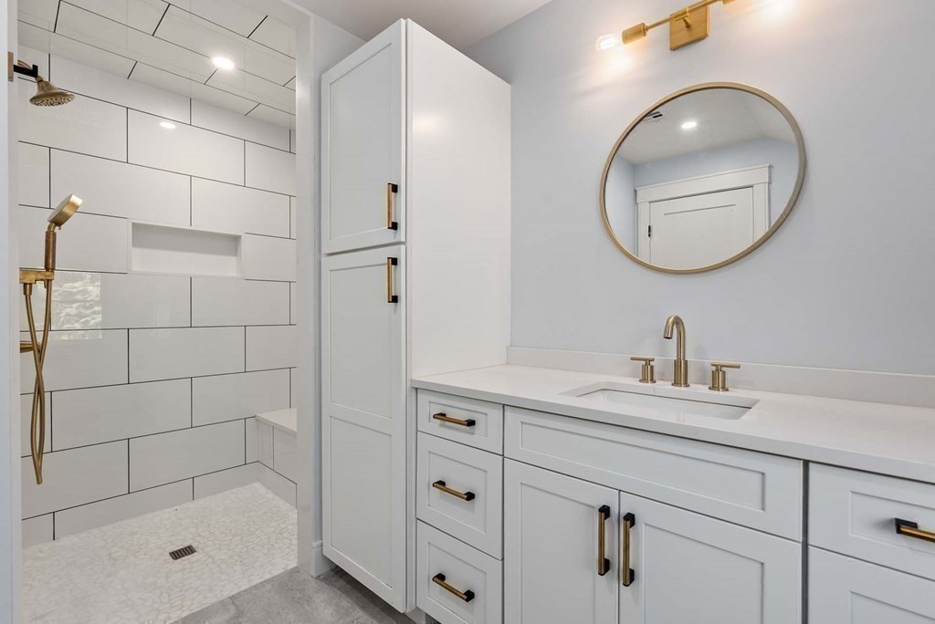 25 Geraldine Drive Wellesley, MA 02481 - Photo 11 of 24 a bathroom with a sink a toilet and shower