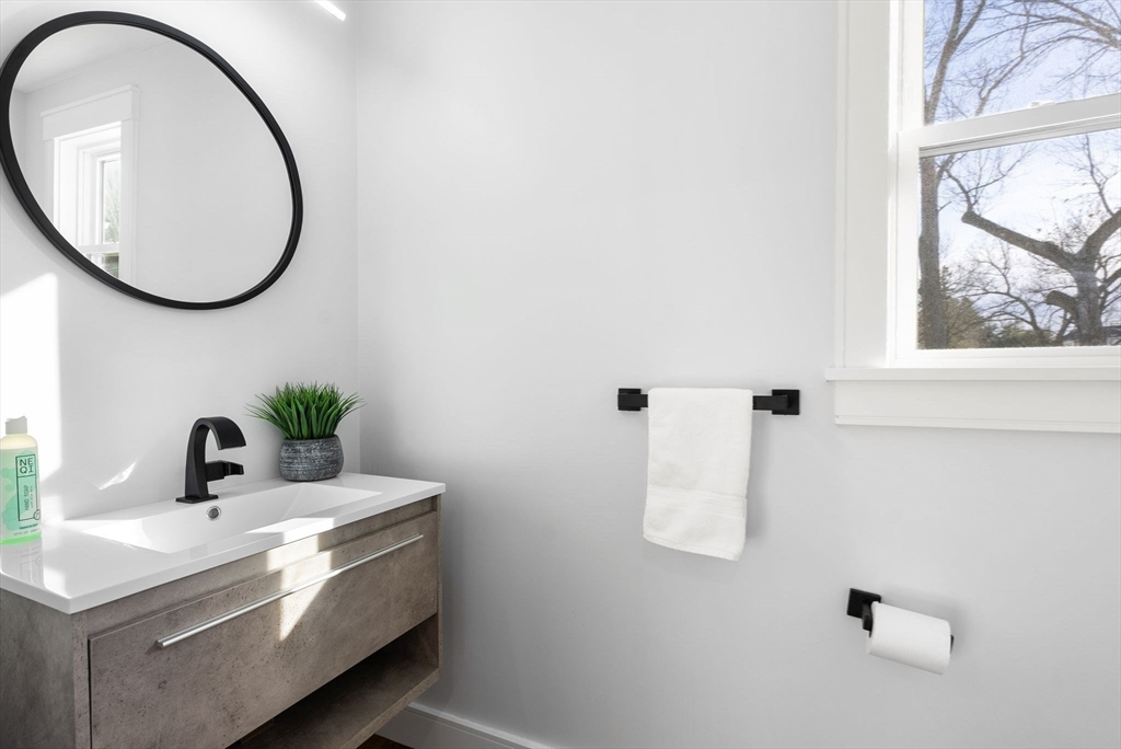 25 Geraldine Drive Wellesley, MA 02481 - Photo 12 of 24 a bathroom with a sink and a mirror