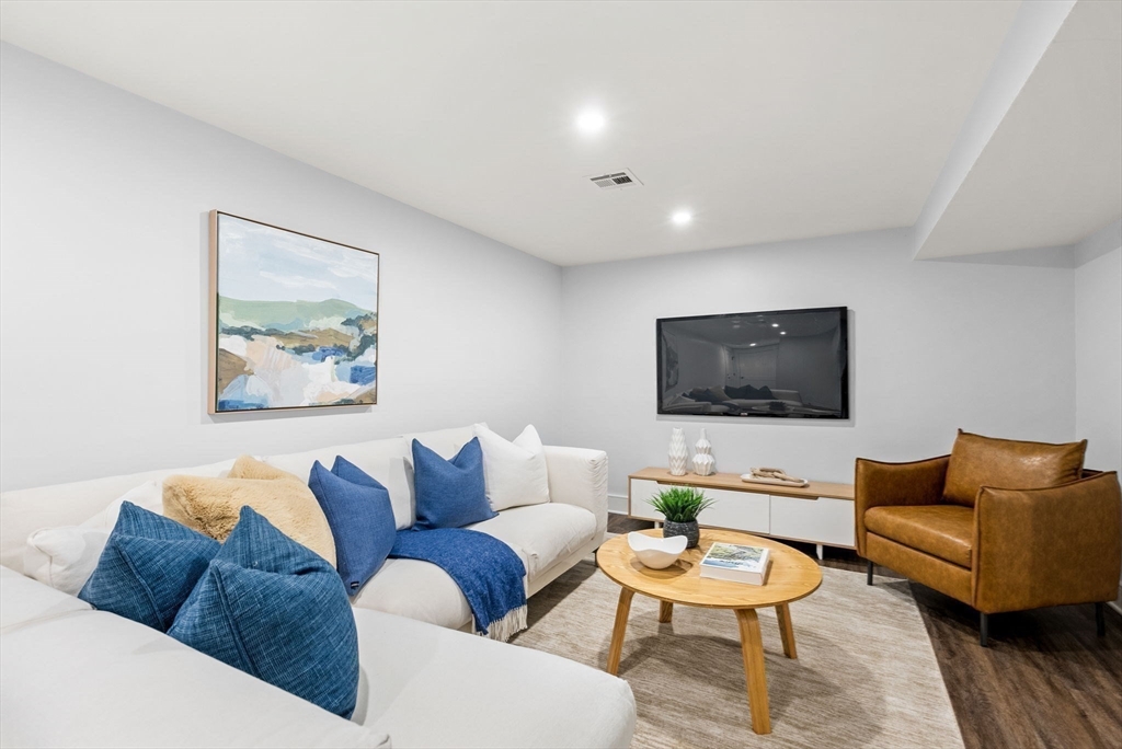 25 Geraldine Drive Wellesley, MA 02481 - Photo 19 of 24 a living room with furniture and a flat screen tv