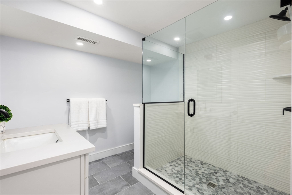 25 Geraldine Drive Wellesley, MA 02481 - Photo 20 of 24 a bathroom with a shower and a sink
