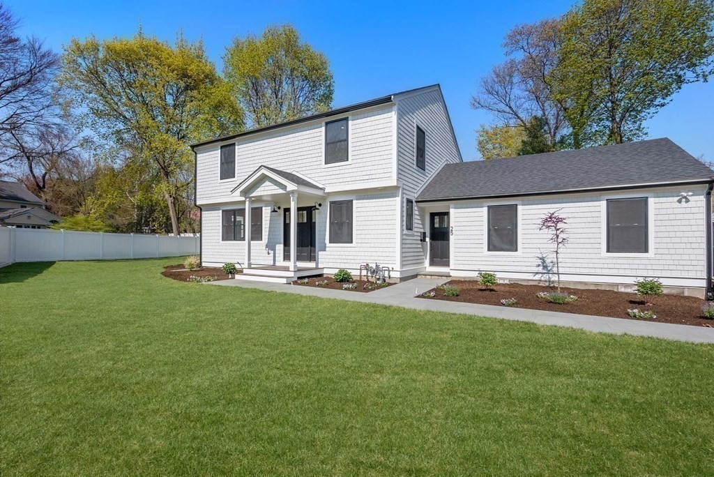 25 Geraldine Drive Wellesley, MA 02481 - Photo 22 of 24 a front view of a house with yard and green space
