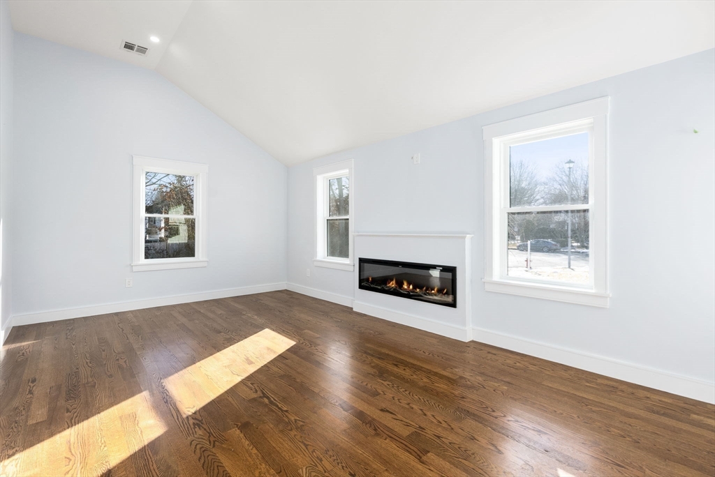 25 Geraldine Drive Wellesley, MA 02481 - Photo 10 of 24 a view of a room with wooden floor fireplace and windows