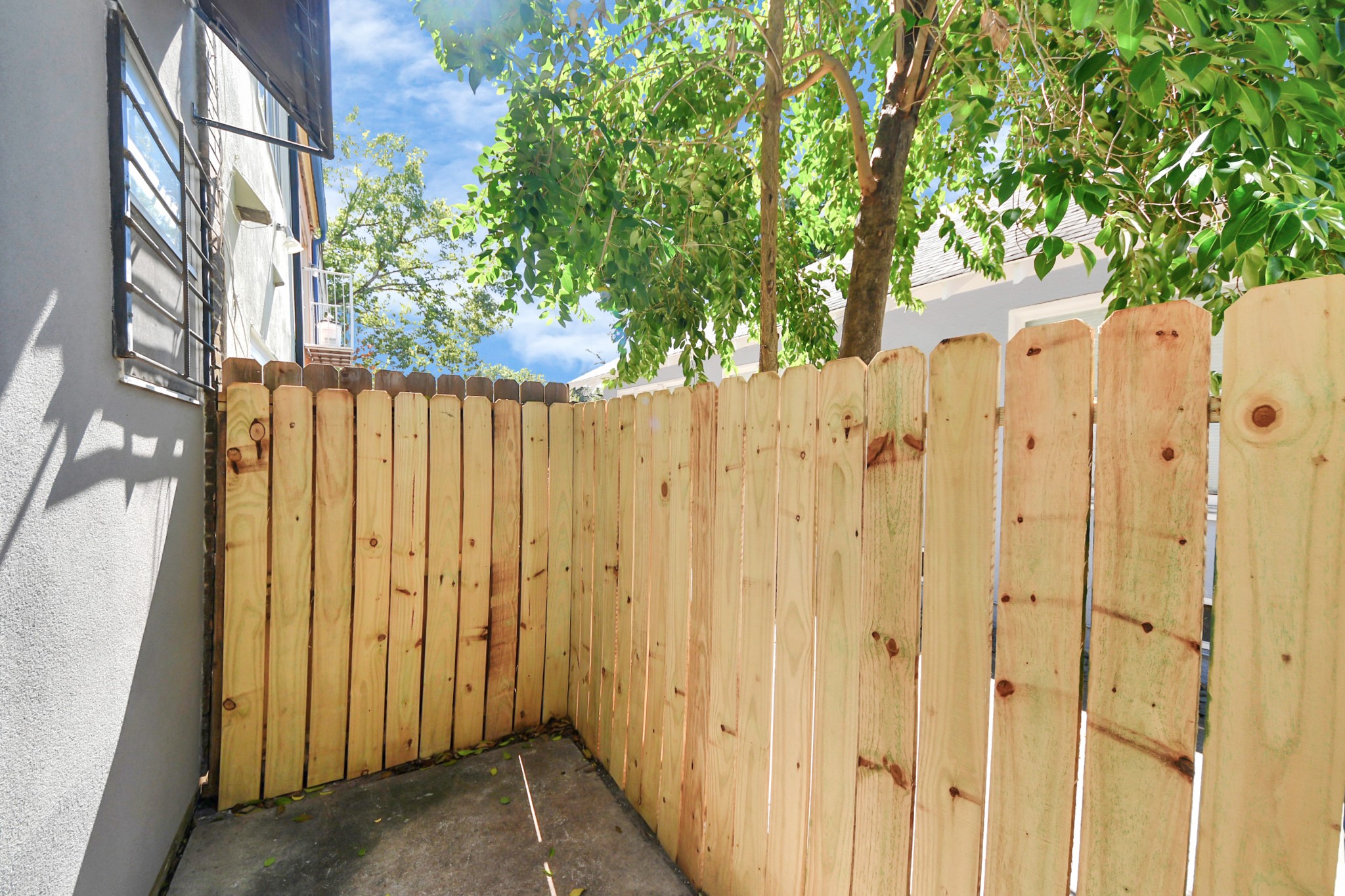 3540 Yupon Street Houston, TX 77006 - Photo 8 of 22 a view of a wooden fence