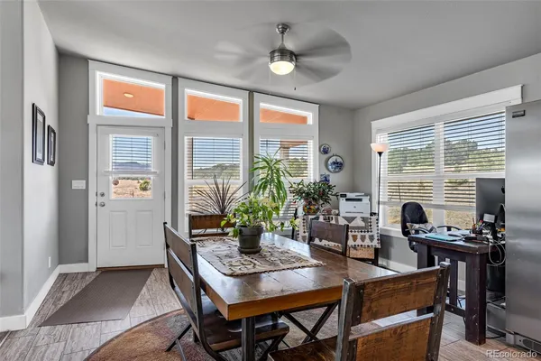 a view of a dining room with furniture window and outside view