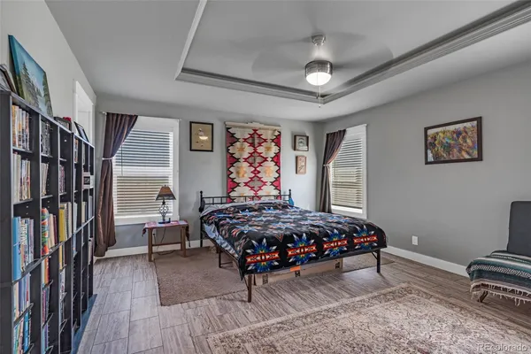 a bedroom with furniture window and flowerpot
