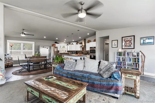 a living room with furniture and a rug