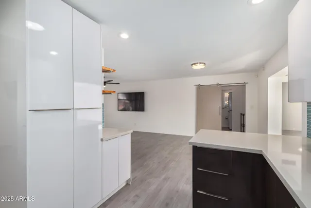 a view of kitchen with wooden floor