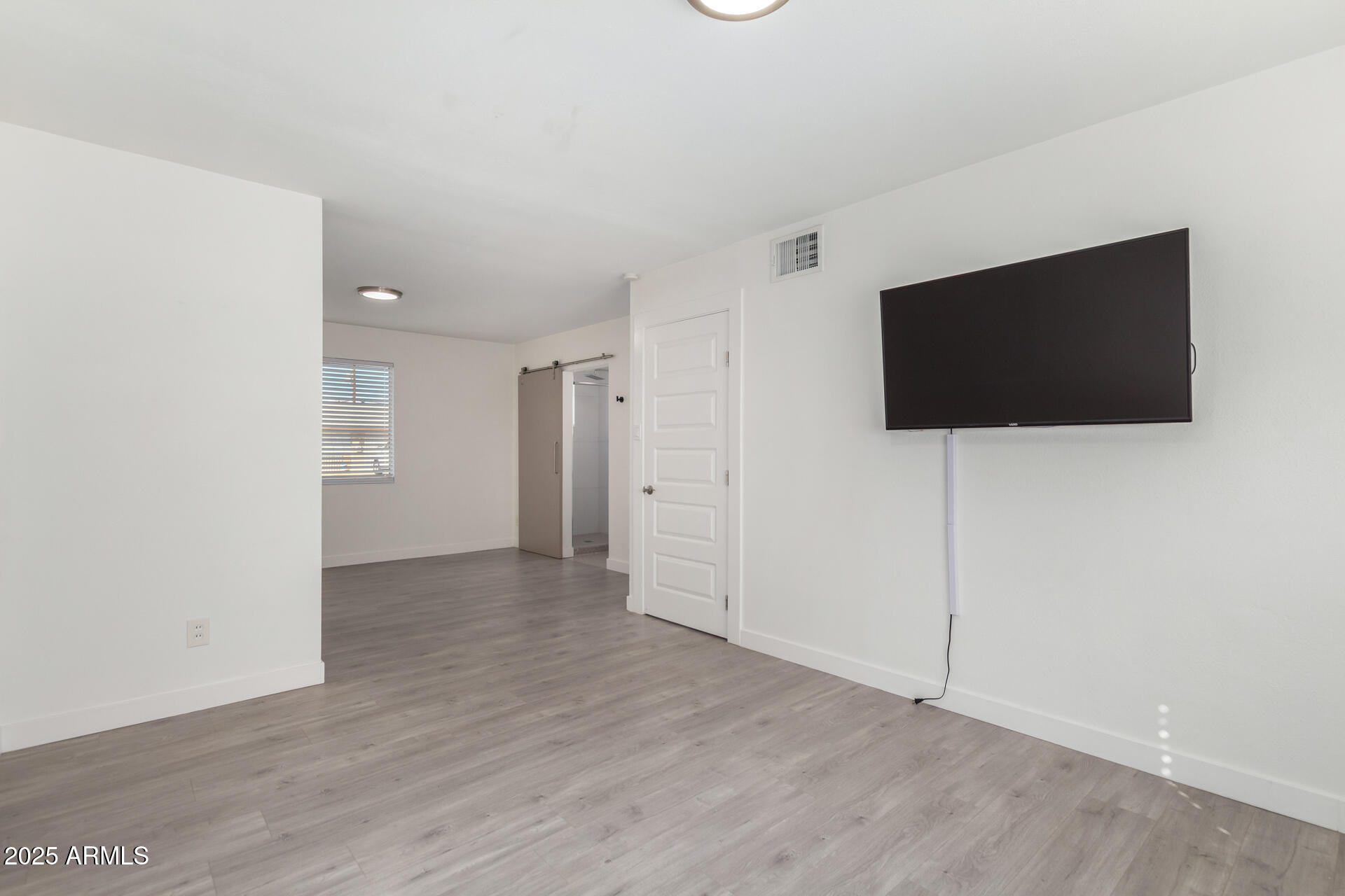 3329 East Palm Lane Phoenix, AZ 85008 - Photo 17 of 45 a view of a livingroom with wooden floor