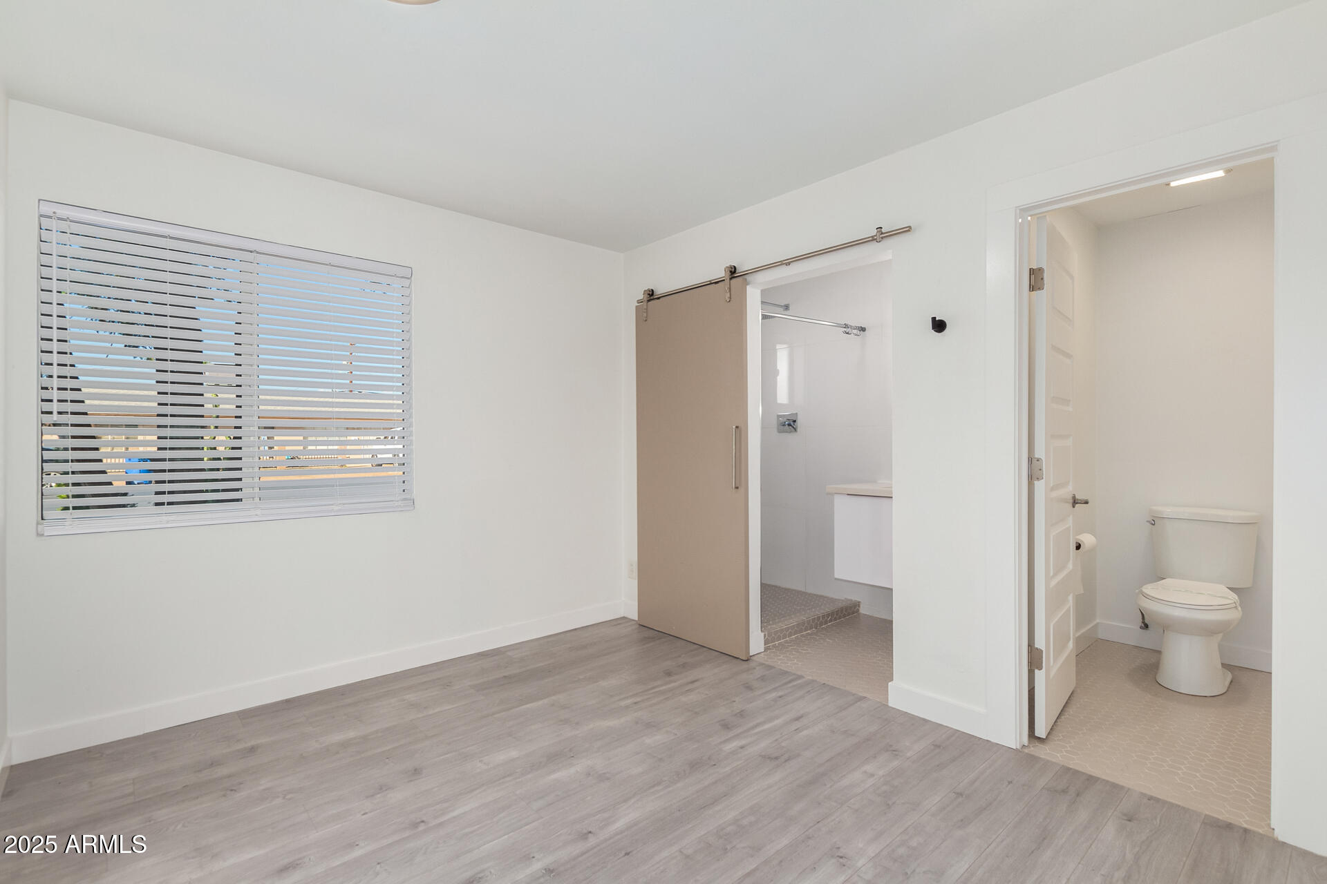 3329 East Palm Lane Phoenix, AZ 85008 - Photo 20 of 45 a bathroom view of a toilet and a shower