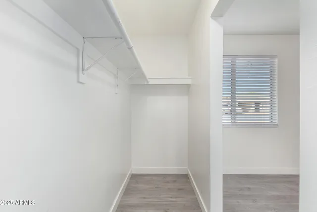 a view of a room that has a window in it