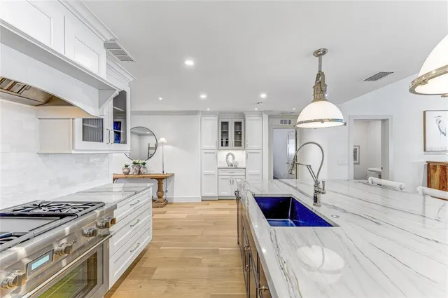 a bathroom with a shower sink double vanity and mirror