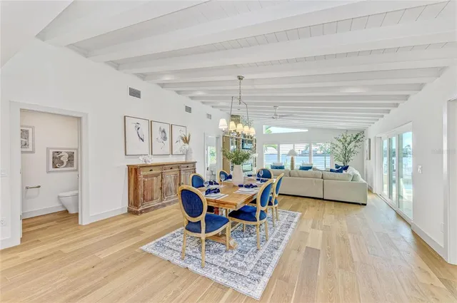 a spacious bathroom with a double vanity sink a mirror and a shower