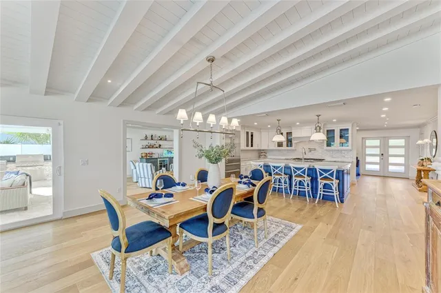 a bedroom with two beds and a large window