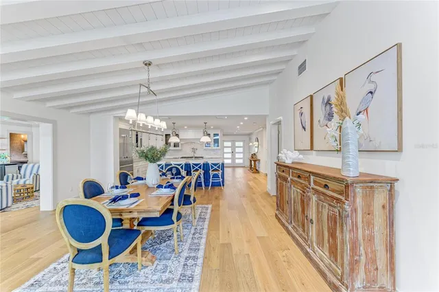 a bedroom with two beds and a large window