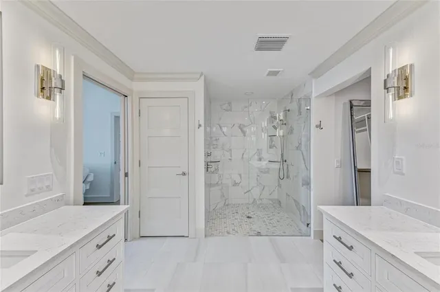 an aerial view of a house with a ocean view