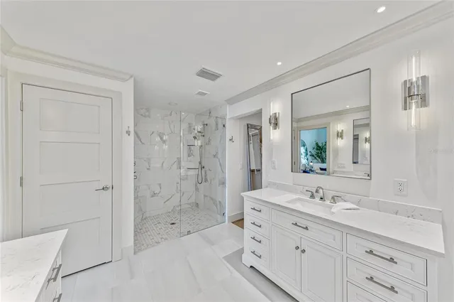 an aerial view of residential houses with outdoor space and lake view