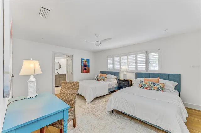 an aerial view of a house with a yard and large trees