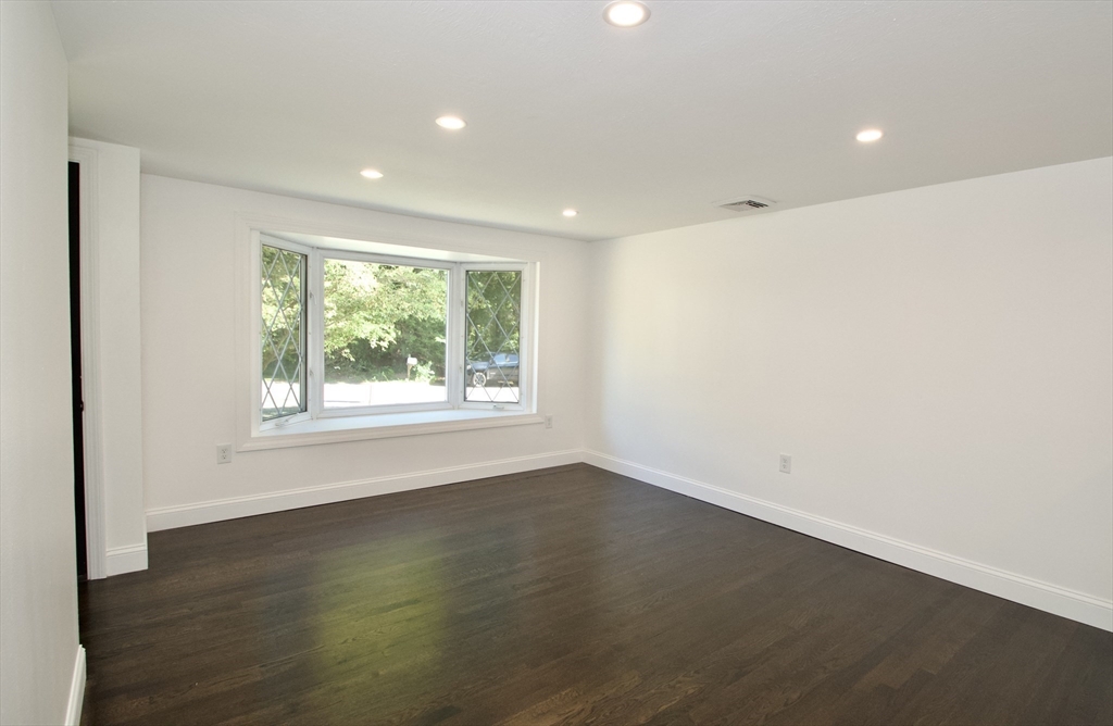 7 Barbara Road Kingston, MA 02364 - Photo 10 of 26 an empty room with wooden floor and windows