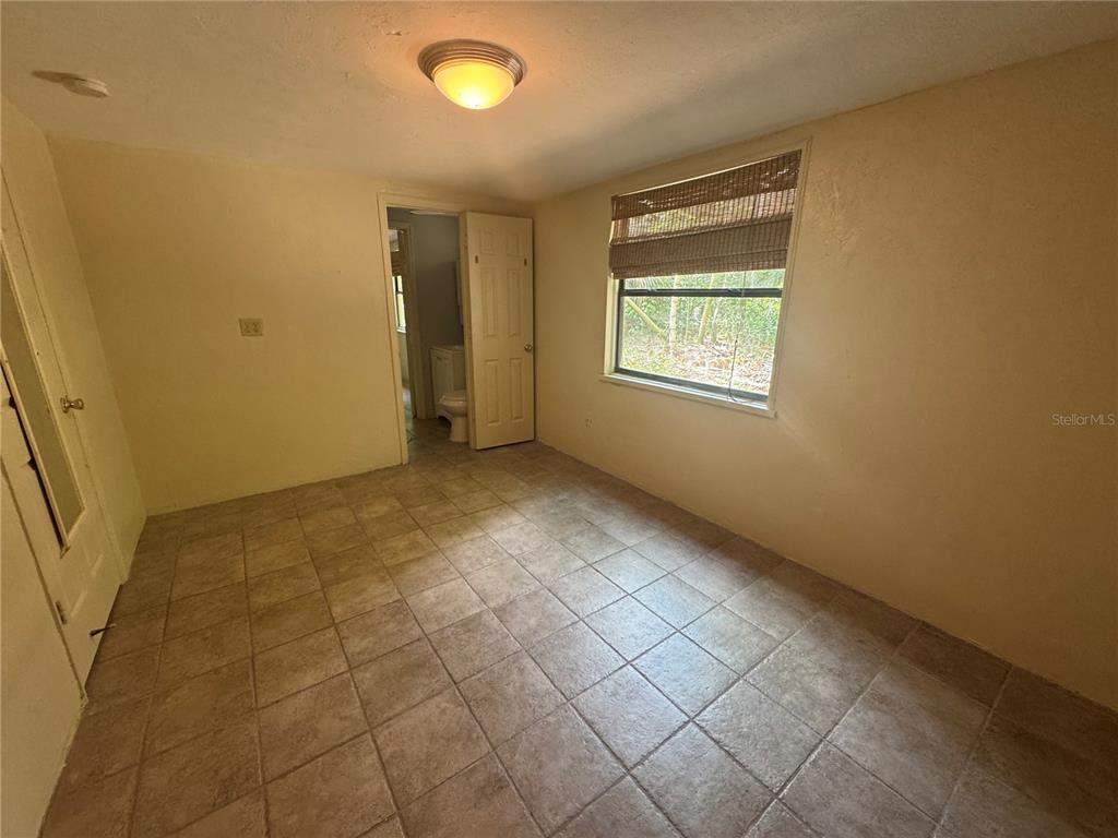 3 Northwest 24 Street Gainesville, FL 32607 - Photo 13 of 22 a view of an empty room with a window