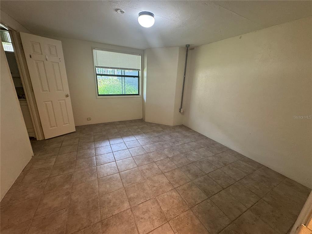3 Northwest 24 Street Gainesville, FL 32607 - Photo 17 of 22 an empty room with windows