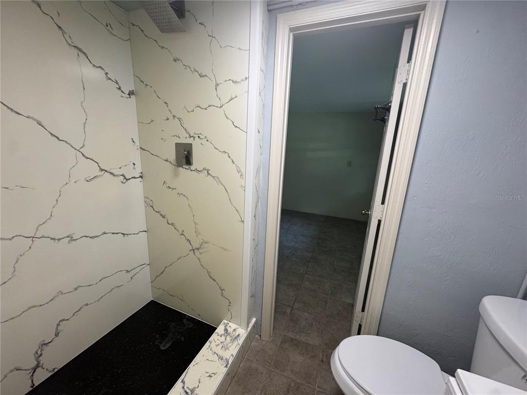 3 Northwest 24 Street Gainesville, FL 32607 - Photo 18 of 22 a bathroom with a toilet and a shower