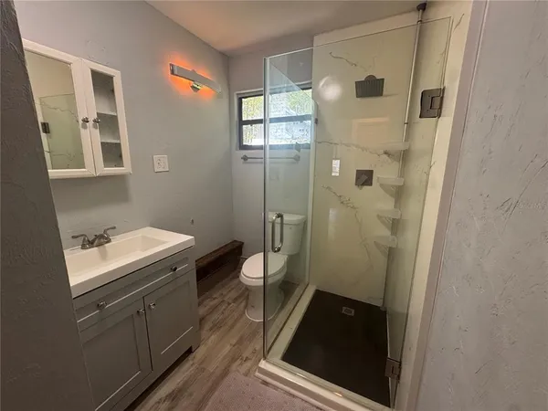 a bathroom with a sink and mirror