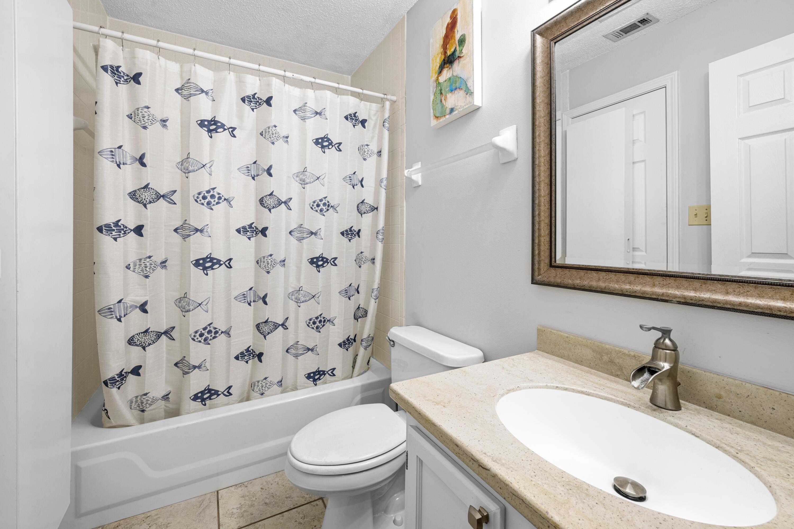 200 Sandestin Lane, Unit 1209 Miramar Beach, FL 32550 - Photo 17 of 30 a bathroom with a sink and a mirror