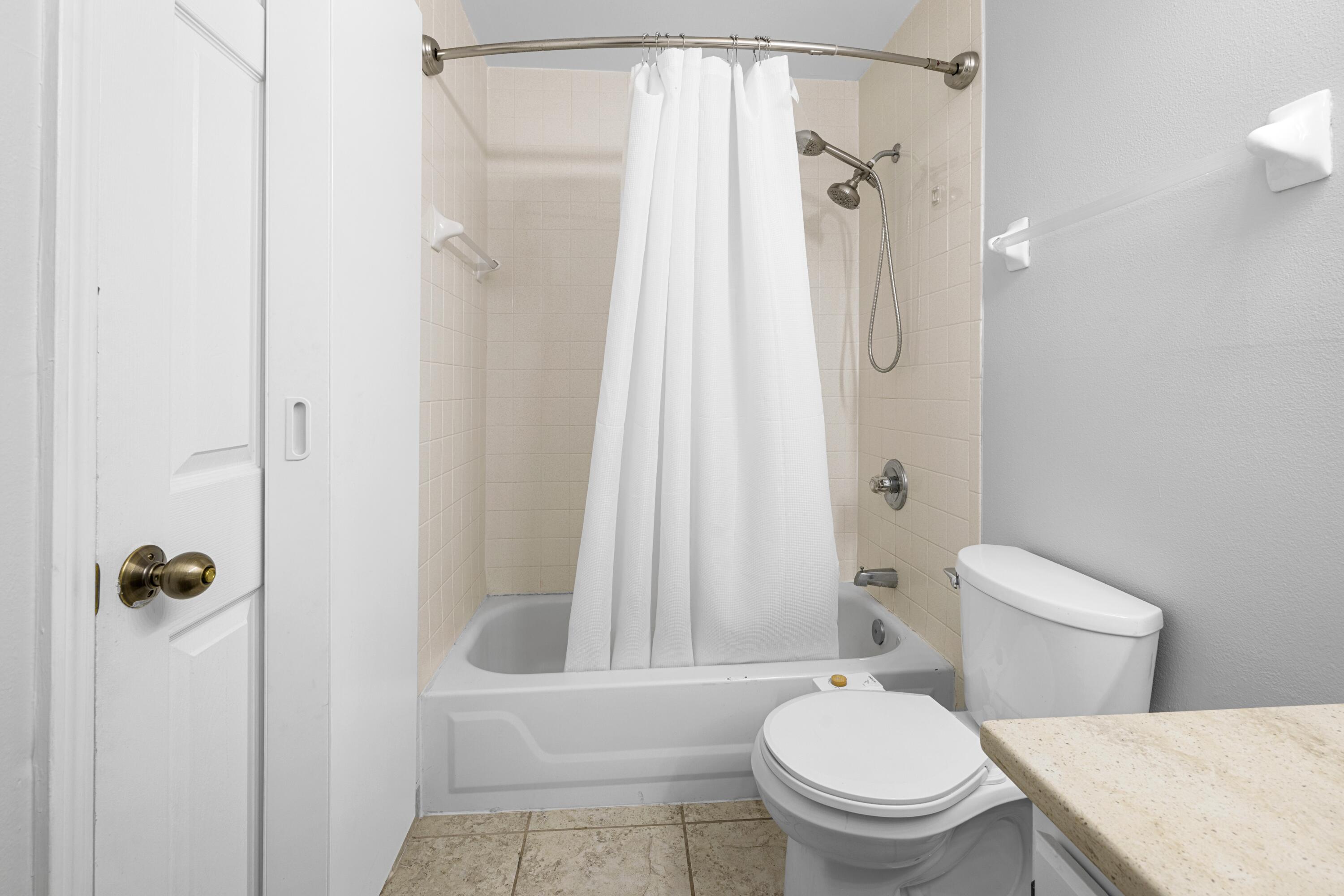 200 Sandestin Lane, Unit 1209 Miramar Beach, FL 32550 - Photo 22 of 30 a bathroom with a toilet a sink and shower