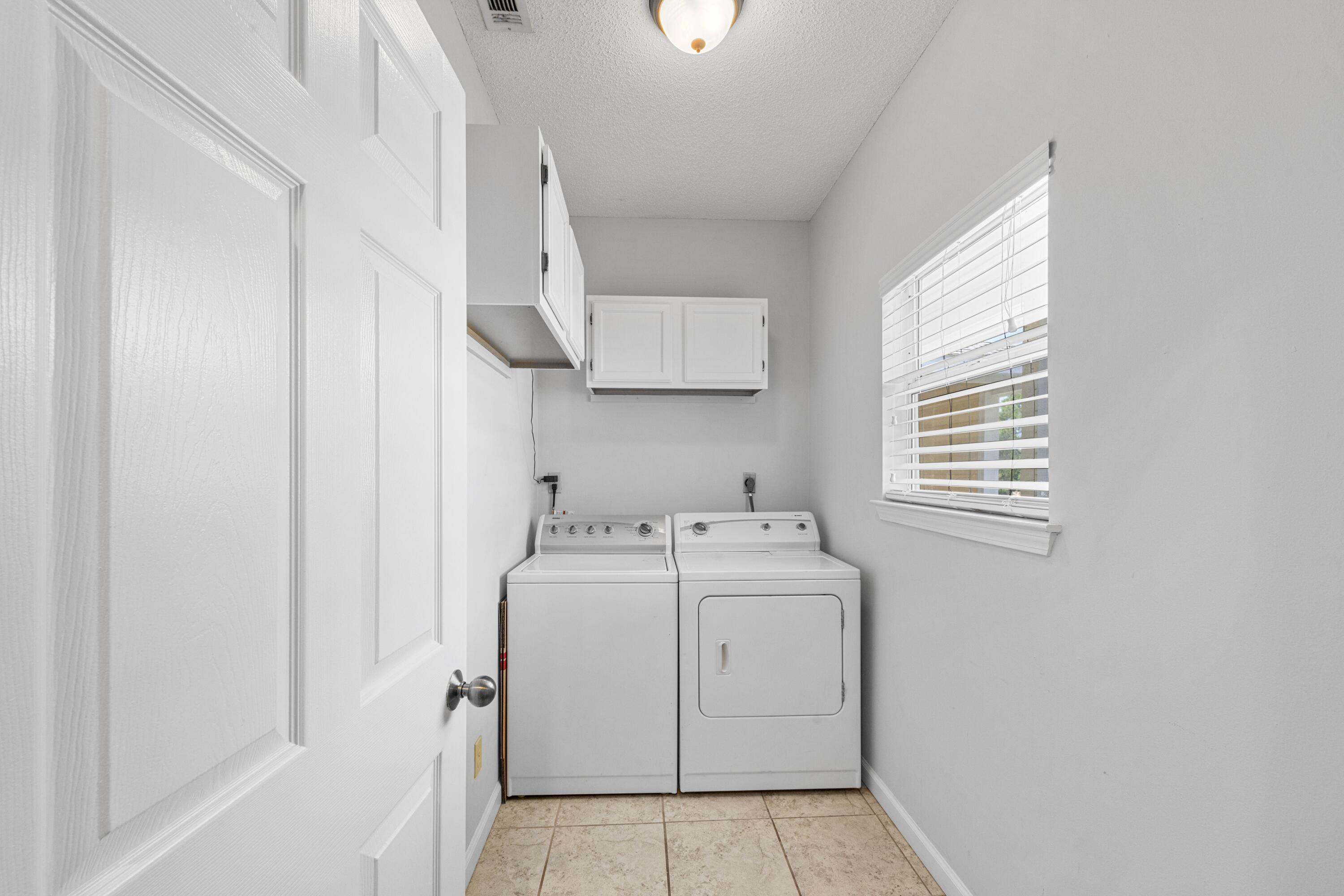 200 Sandestin Lane, Unit 1209 Miramar Beach, FL 32550 - Photo 24 of 30 a utility room with dryer and washer