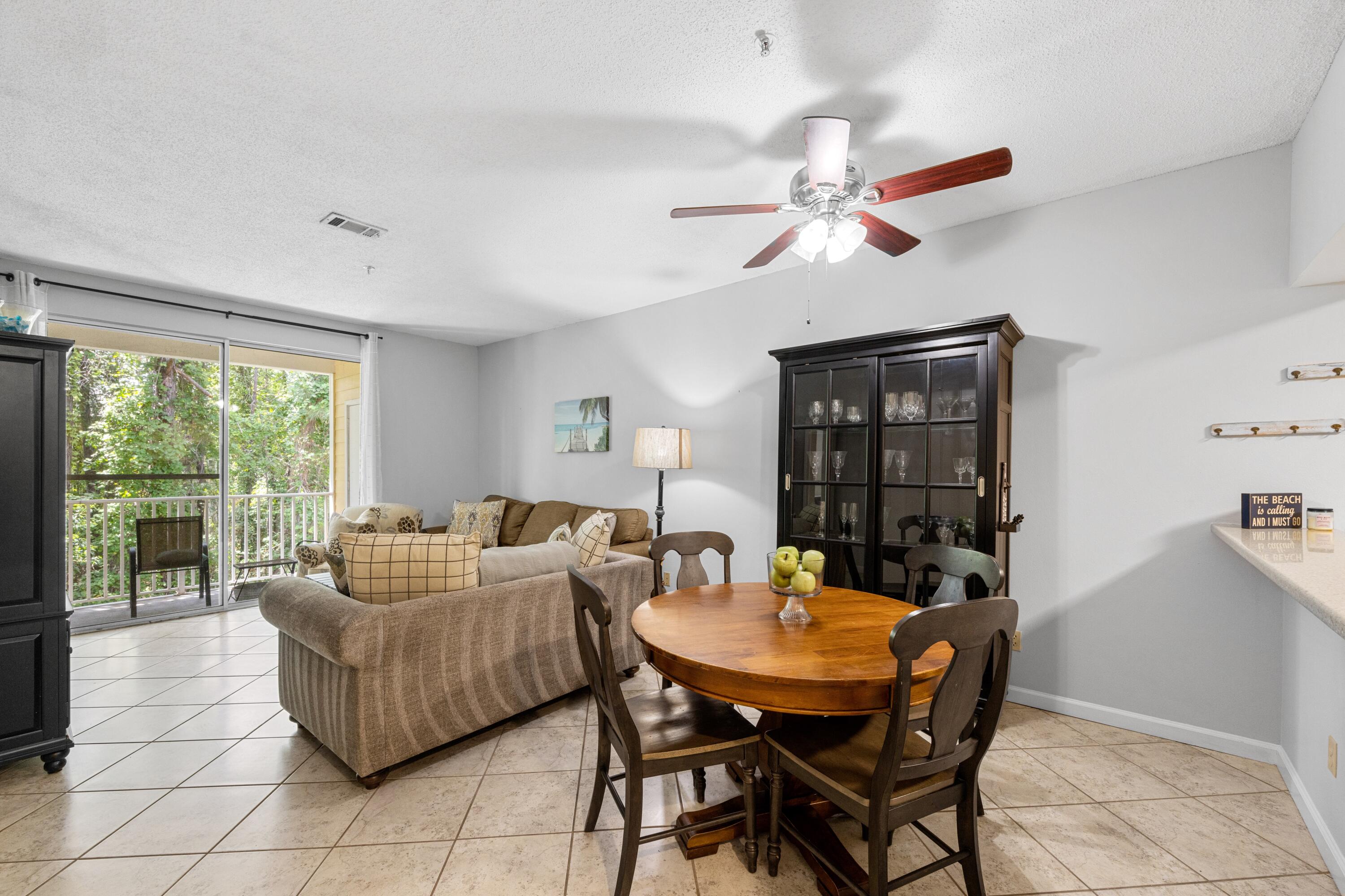 200 Sandestin Lane, Unit 1209 Miramar Beach, FL 32550 - Photo 6 of 30 a living room with furniture a chandelier and a table