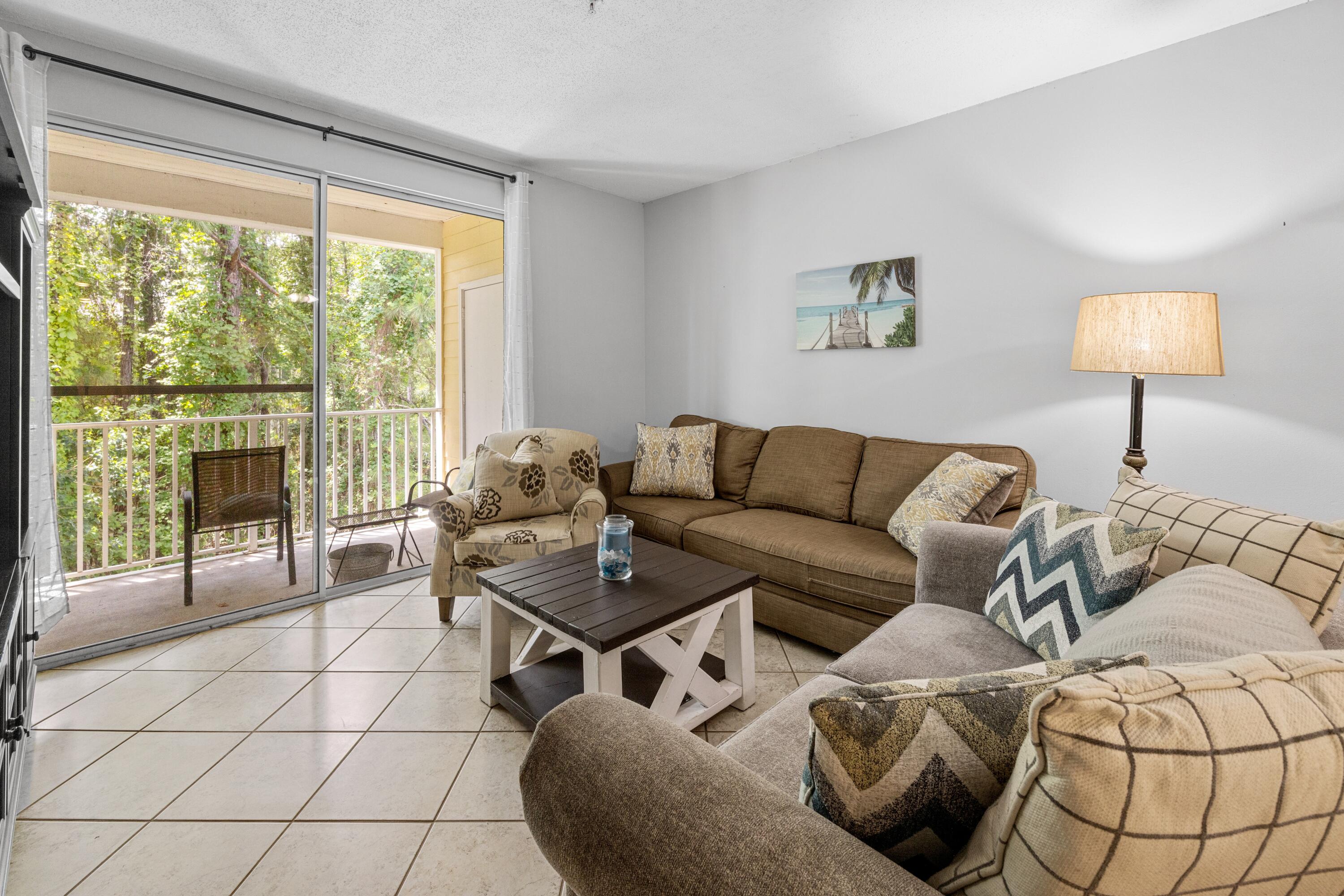 200 Sandestin Lane, Unit 1209 Miramar Beach, FL 32550 - Photo 9 of 30 a living room with furniture and a large window