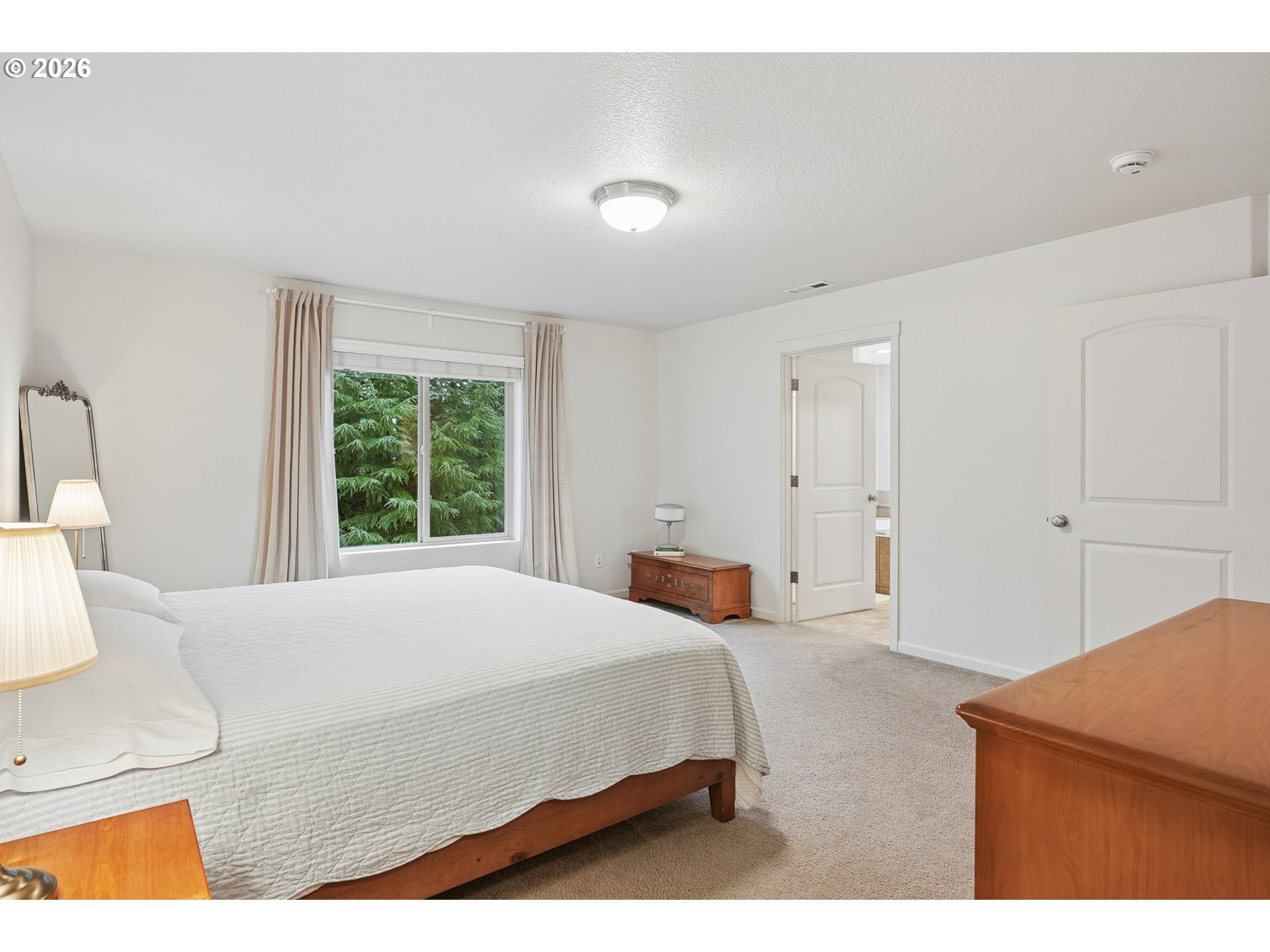 504 North Allen Creek Drive Ridgefield, WA 98642 - Photo 23 of 38 a bedroom with a bed and a night stand