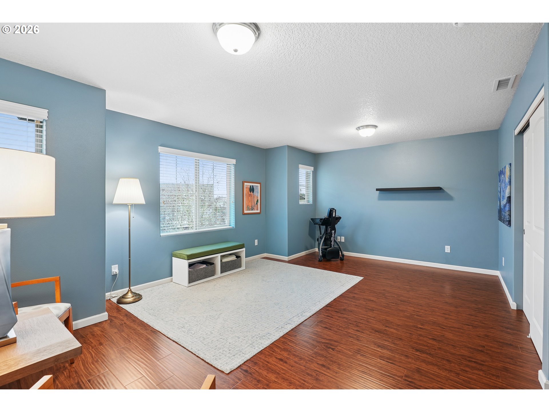504 North Allen Creek Drive Ridgefield, WA 98642 - Photo 28 of 38 a bedroom with a bed and a night stand