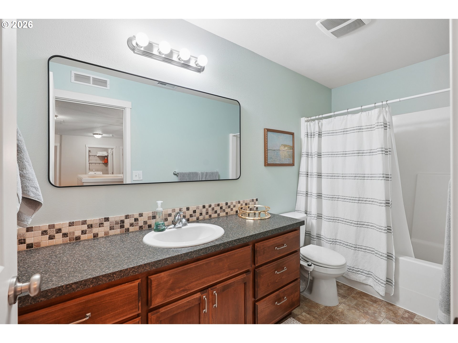 504 North Allen Creek Drive Ridgefield, WA 98642 - Photo 31 of 38 a bathroom with a double vanity sink toilet and a mirror